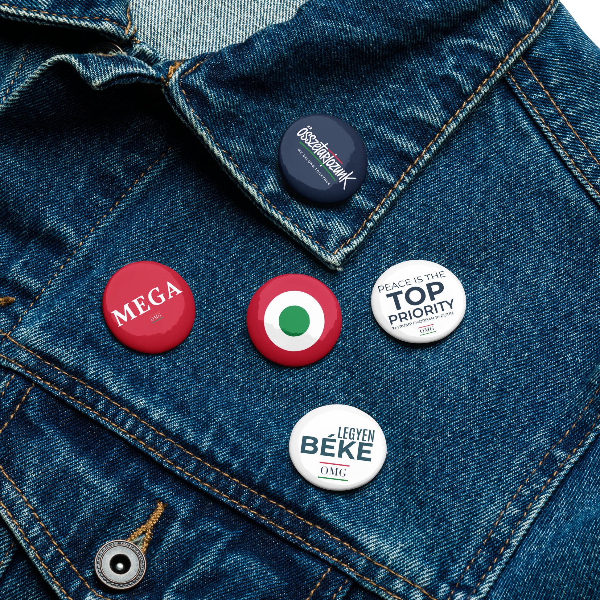 Buttons on a denim jacket with various text and designs.
